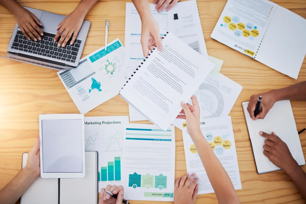 team discussing Best Practices For Creating Effective Nonprofit Annual Reports