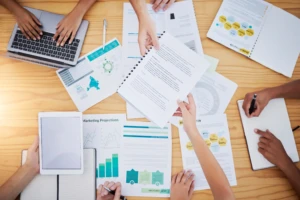 team discussing Best Practices For Creating Effective Nonprofit Annual Reports