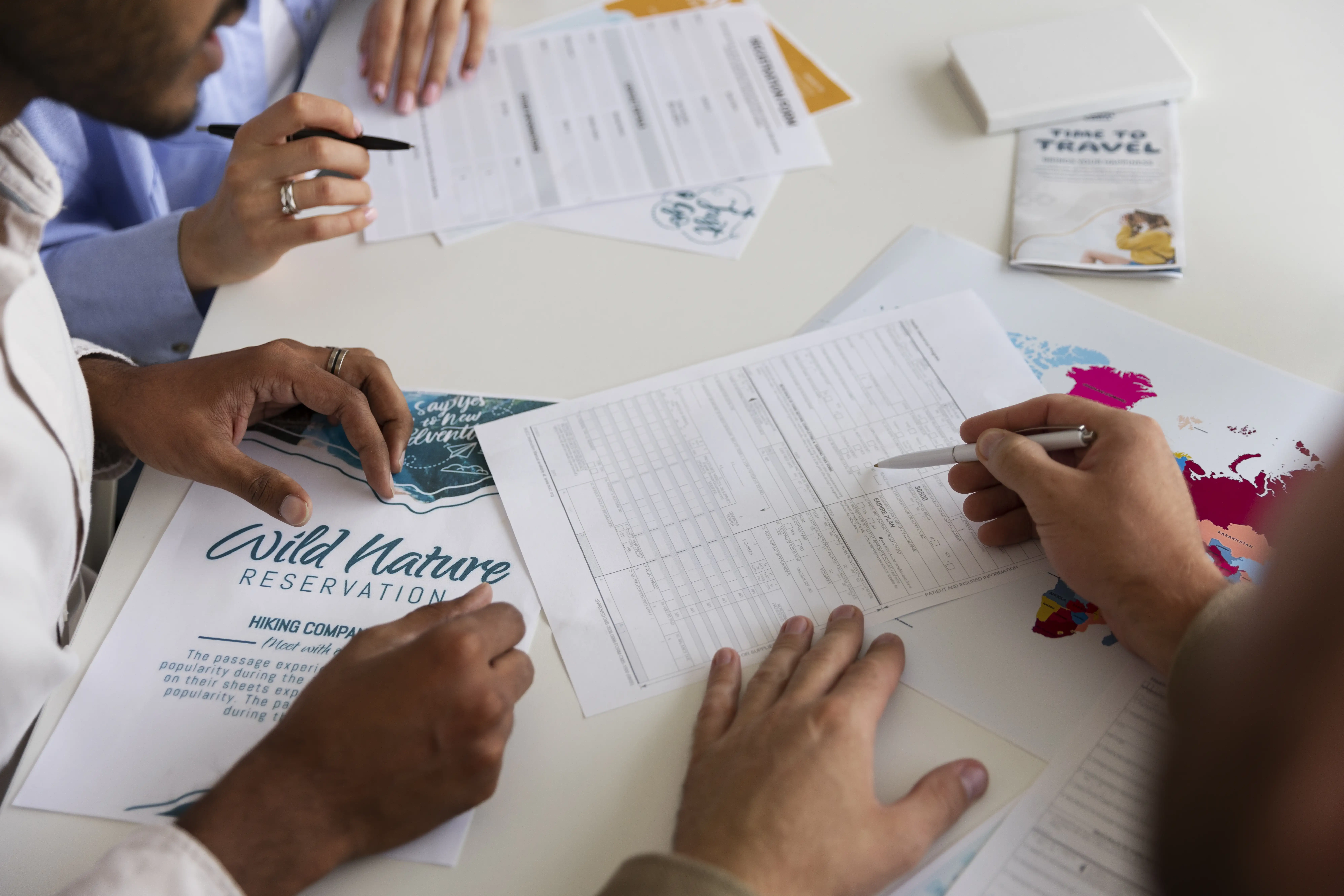 NGO team reviewing documents and data for annual report, discussing social sector programs, impact reports, and nonprofit planning.