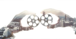 Hands holding gears symbolizing collaboration in the social sector, supporting development sector film services for NGOs and non profit work.