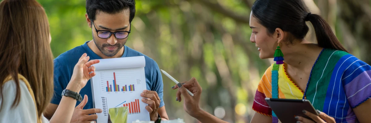 team discussing Best Practices For Creating Effective Nonprofit Annual Reports