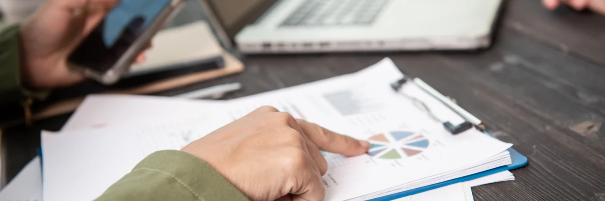 Team reviewing documents to Prepare An NGO’s Annual Report